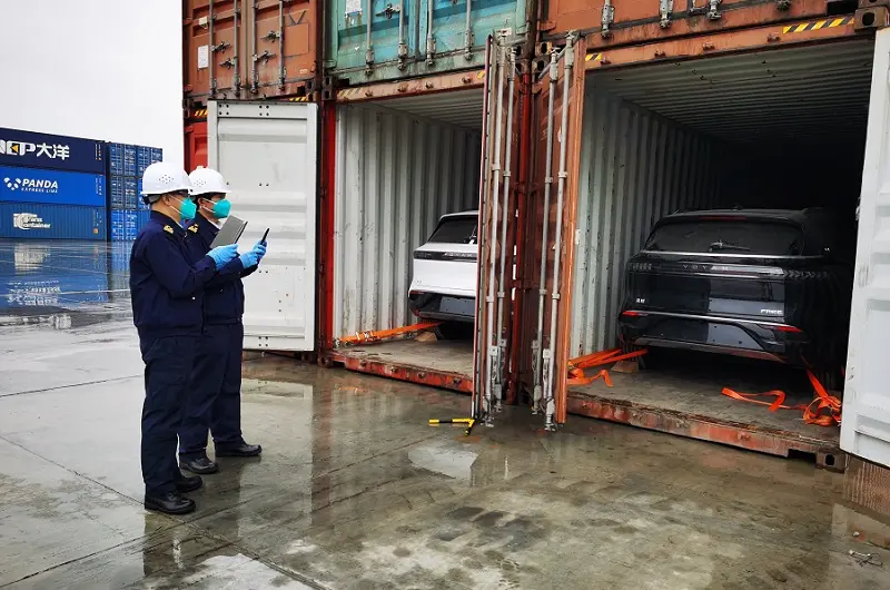 Customs officers inspect NEVs exported via China-Europe Railway Express