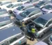 Customs officers at Shanghai Waigaoqiao Port inspect exported new energy vehicles
